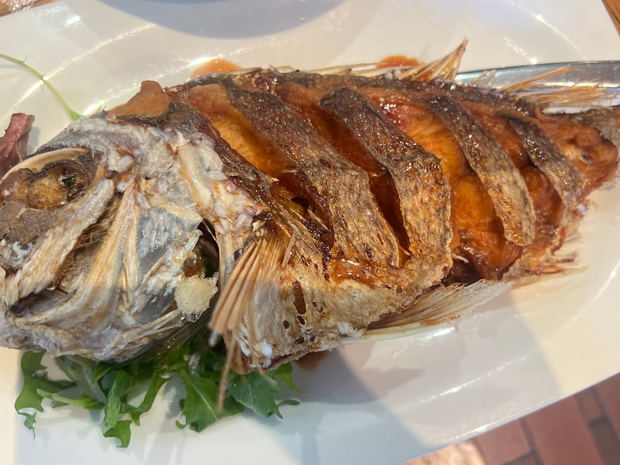Whole fried fish served at Caysorn Thai